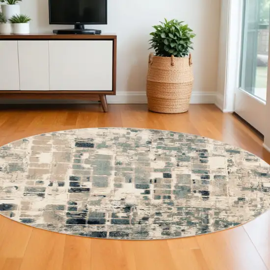 8' Blue and Beige Round Abstract Area Rug Photo 1