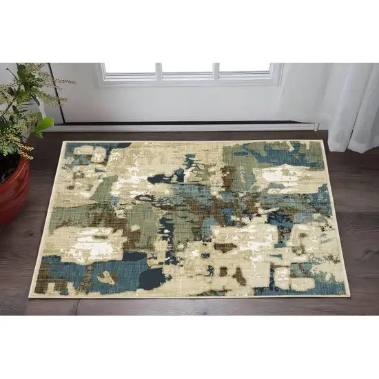 Beige Blue And Brown Abstract Area Rug Photo 1