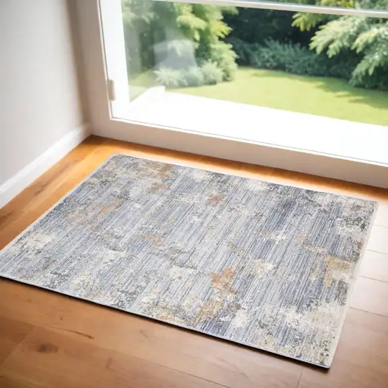 Beige Blue and Gray Abstract Area Rug With Fringe Photo 1