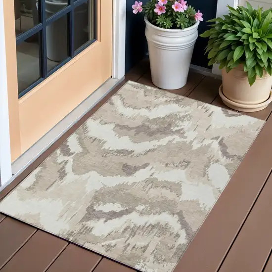 Beige Brown And Ivory Abstract Washable Indoor Outdoor Area Rug Photo 1