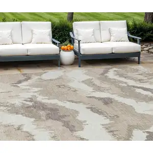 Photo of Beige Brown And Ivory Abstract Washable Indoor Outdoor Area Rug