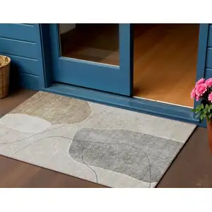 Photo of Beige Brown And Taupe Abstract Washable Indoor Outdoor Area Rug