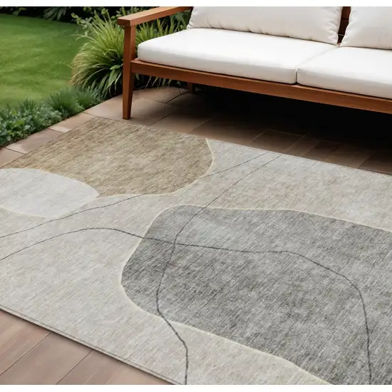 Beige Brown And Taupe Abstract Washable Indoor Outdoor Area Rug Photo 1