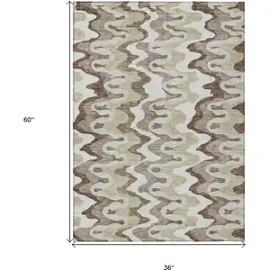 Photo of Beige Brown And Taupe Abstract Washable Indoor Outdoor Area Rug