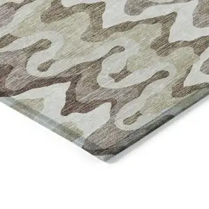 Photo of Beige Brown And Taupe Abstract Washable Indoor Outdoor Area Rug