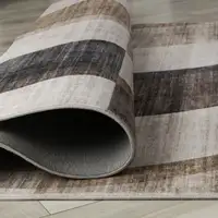 Photo of Beige Brown and Gray Checkered Area Rug