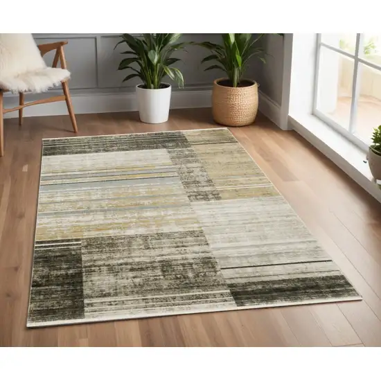 Beige Charcoal Brown Grey Tan Gold And Blue Geometric Power Loom Stain Resistant Area Rug With Fringe Photo 1