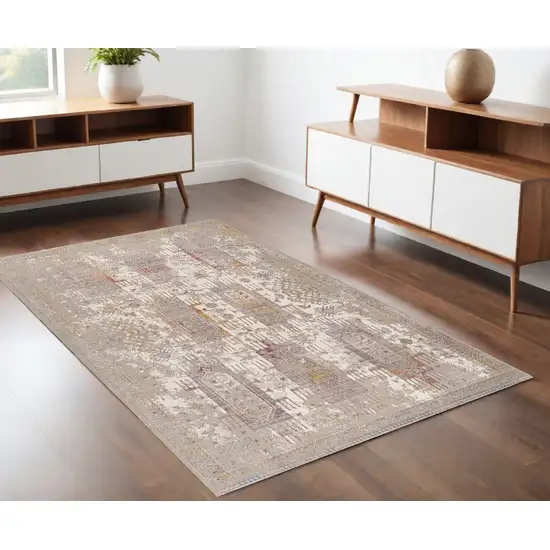 Beige and Ivory Medallion Power Loom Distressed Area Rug Photo 1