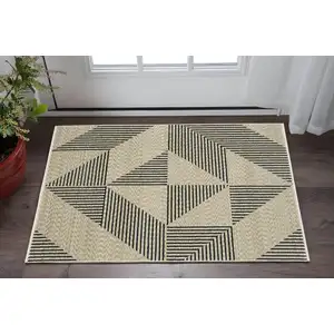 Photo of Beige Geometric Area Rug With Fringe