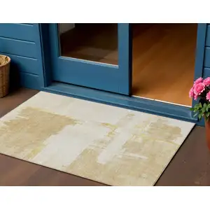 Photo of Beige Gold And Tan Abstract Washable Indoor Outdoor Area Rug