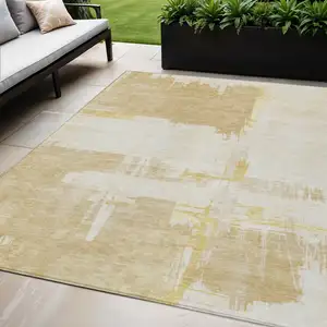 Photo of Beige Gold And Tan Abstract Washable Indoor Outdoor Area Rug