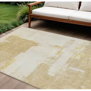 Photo of Beige Gold And Tan Abstract Washable Indoor Outdoor Area Rug