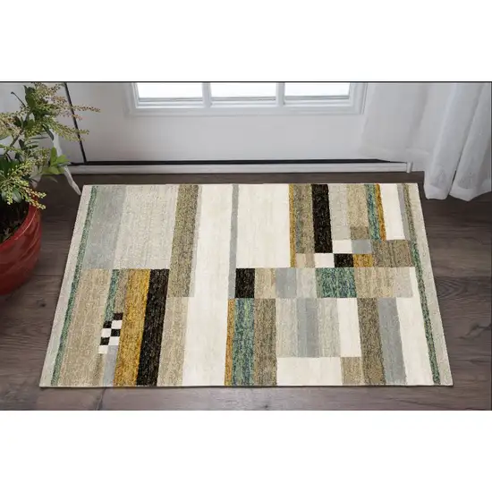 Beige Gold Black Grey Tan Teal and Rust Geometric Power Loom Area Rug Photo 1