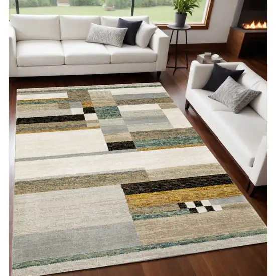 Beige Gold Black Grey Tan Teal and Rust Geometric Power Loom Area Rug Photo 1