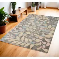 Photo of Beige Gray And Blue Botanical Leaves Area Rug