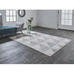 Photo of Beige Gray And Ivory Geometric Stain Resistant Area Rug