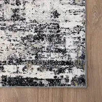 Photo of Beige Gray and White Abstract Area Rug