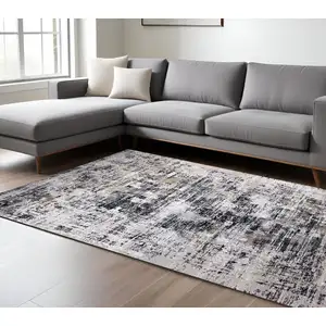 Photo of Beige Gray and White Abstract Area Rug