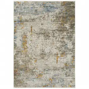 Photo of Beige Grey Brown Gold Red And Blue Abstract Power Loom Stain Resistant Area Rug With Fringe