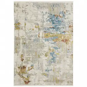 Photo of Beige Grey Gold Blue Rust And Teal Abstract Power Loom Stain Resistant Area Rug With Fringe