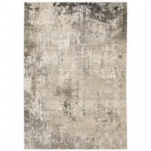 Photo of Beige Grey Ivory Tan And Brown Abstract Power Loom Stain Resistant Area Rug