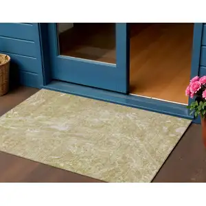 Photo of Beige Ivory And Artichoke Green Abstract Washable Indoor Outdoor Area Rug