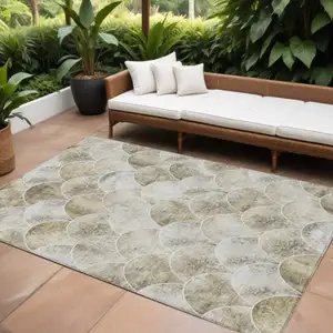 Photo of Beige Ivory And Tan Abstract Washable Indoor Outdoor Area Rug