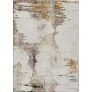 Photo of Beige Ivory And Taupe Abstract Washable Indoor Outdoor Area Rug