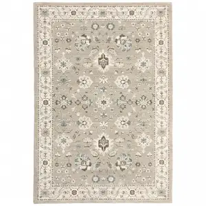 Photo of Beige Ivory Blue Green And Purple Oriental Power Loom Stain Resistant Area Rug