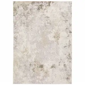 Photo of Beige Ivory Tan Grey And Brown Abstract Power Loom Stain Resistant Area Rug