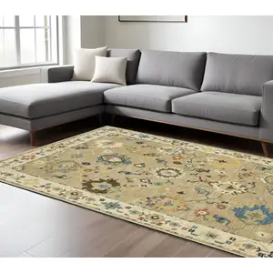 Photo of Beige Light Blue And Tan Oriental Area Rug With Fringe