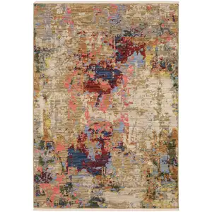 Photo of Beige Red And Blue Abstract Area Rug With Fringe