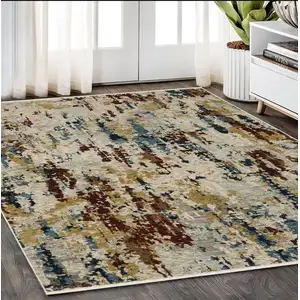 Photo of Beige Rust And Light Blue Abstract Distressed Area Rug With Fringe