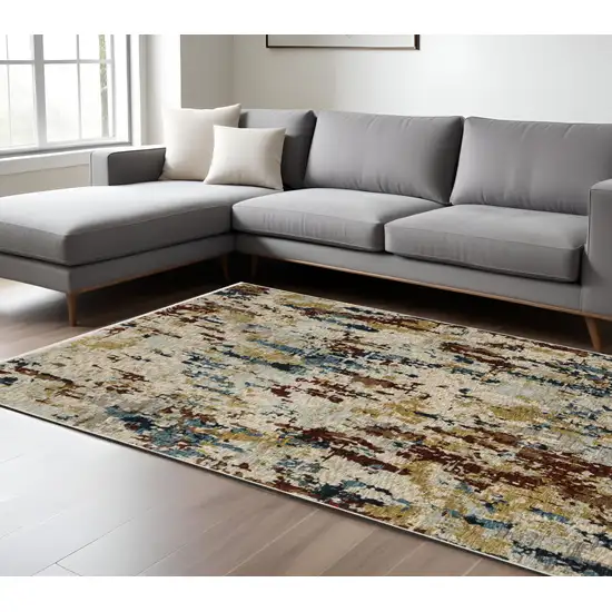 Beige Rust And Light Blue Abstract Distressed Area Rug With Fringe Photo 1