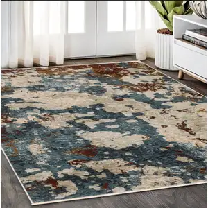 Photo of Beige Rust And Teal Abstract Distressed Area Rug With Fringe