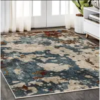 Photo of Beige Rust And Teal Abstract Distressed Area Rug With Fringe