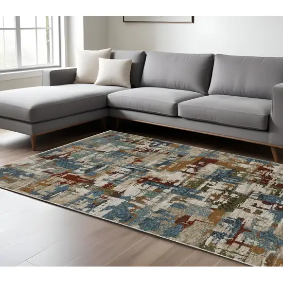 Beige Rust And Teal Abstract Distressed Area Rug With Fringe Photo 1