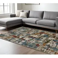 Photo of Beige Rust And Teal Abstract Distressed Area Rug With Fringe