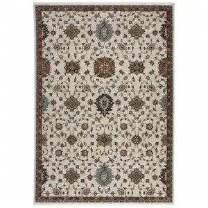 Photo of Beige Rust Red Blue Gold And Grey Oriental Power Loom Stain Resistant Area Rug With Fringe