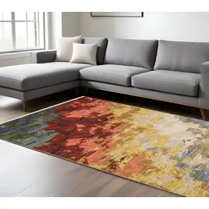 Photo of Beige Salmon And Yellow Abstract Area Rug With Fringe