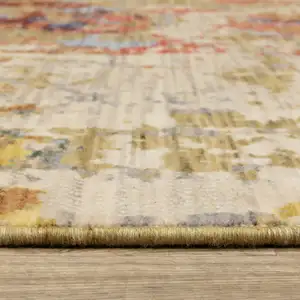 Photo of Beige Salmon And Yellow Abstract Area Rug With Fringe