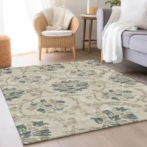 Photo of Beige Tan And Blue Floral Washable Indoor Outdoor Area Rug