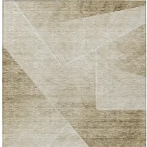 Photo of Beige Tan And Ivory Abstract Washable Indoor Outdoor Area Rug