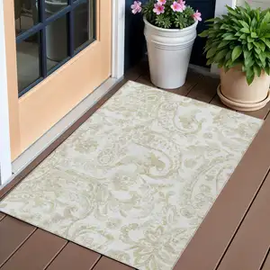 Photo of Beige Tan And Ivory Paisley Washable Indoor Outdoor Area Rug