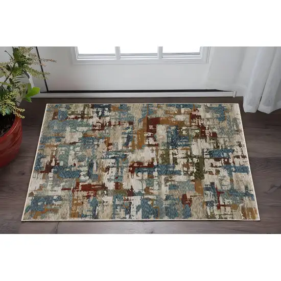 Beige Teal And Brown Abstract Area Rug With Fringe Photo 1