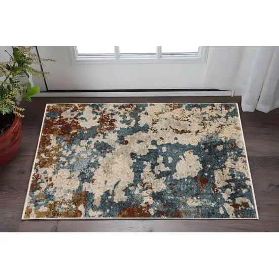 Beige Teal And Rust Abstract Area Rug With Fringe Photo 1