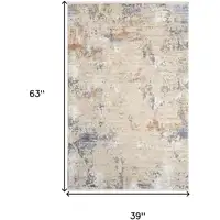 Photo of Beige Teal Blue and Gray Abstract Area Rug With Fringe