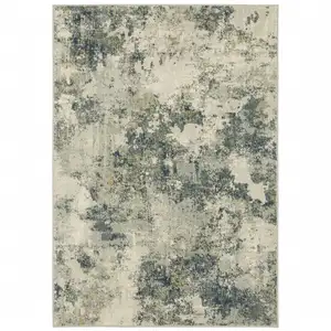 Photo of Beige Teal Grey And Gold Abstract Power Loom Stain Resistant Area Rug