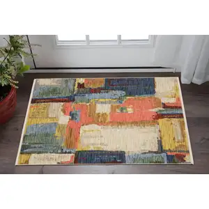 Photo of Beige Yellow And Pink Abstract Area Rug With Fringe