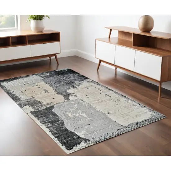 Beige and Black Abstract Distressed Area Rug Photo 1